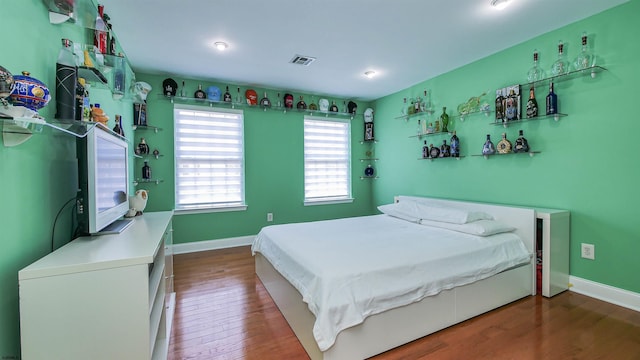 bedroom featuring wood-type flooring