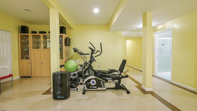 workout area featuring light tile patterned flooring