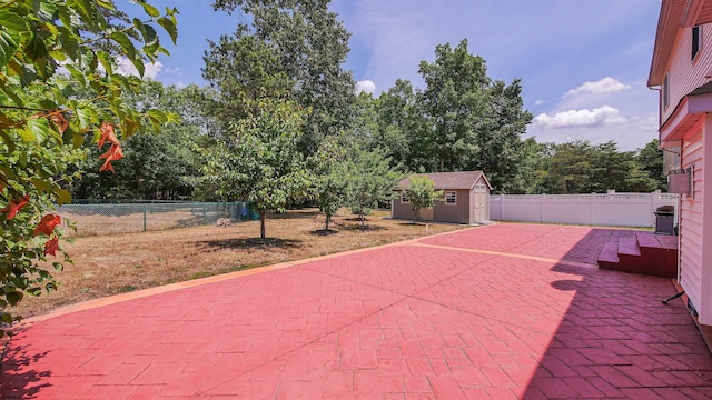 view of patio / terrace featuring a storage shed and a grill