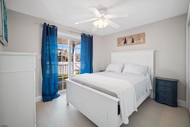 bedroom with light hardwood / wood-style floors and ceiling fan