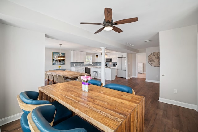 dining room with dark wood-type flooring and ceiling fan