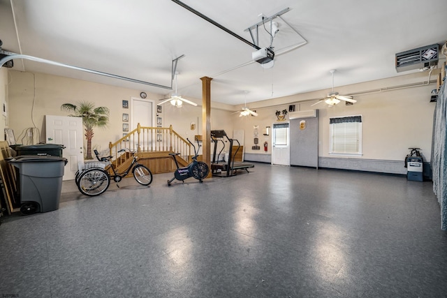 garage with a garage door opener and ceiling fan