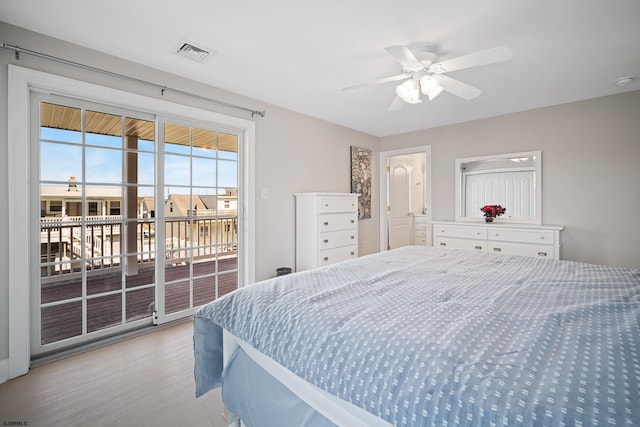 bedroom with access to exterior, light hardwood / wood-style flooring, and ceiling fan