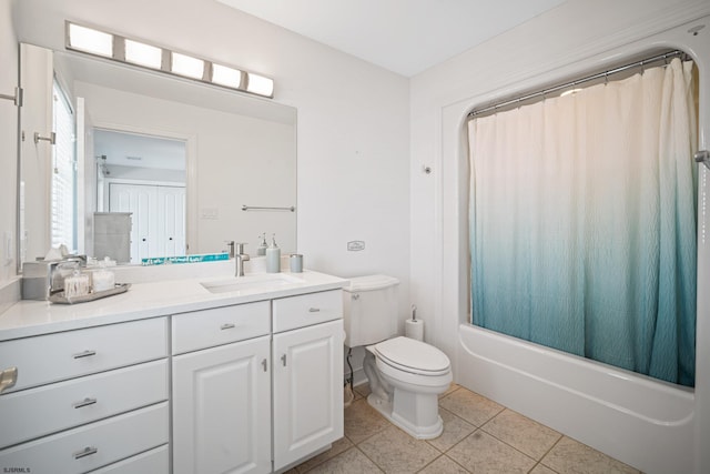 full bathroom featuring shower / tub combo, tile patterned floors, toilet, and vanity