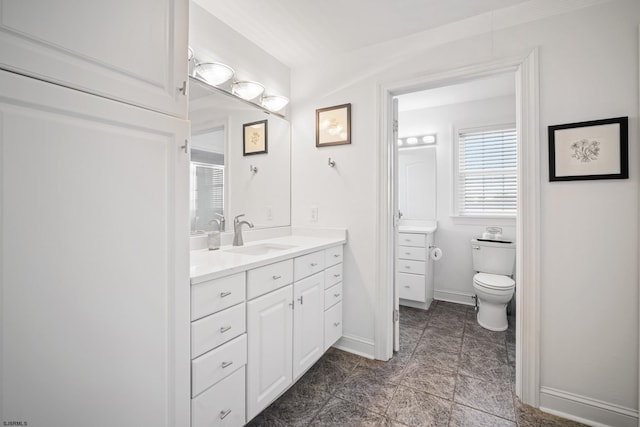 bathroom with vanity, toilet, and tile patterned flooring