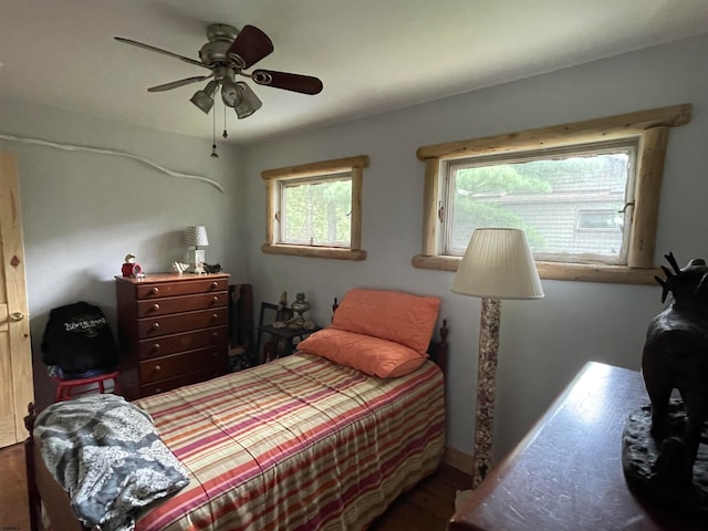 bedroom featuring wood-type flooring and ceiling fan