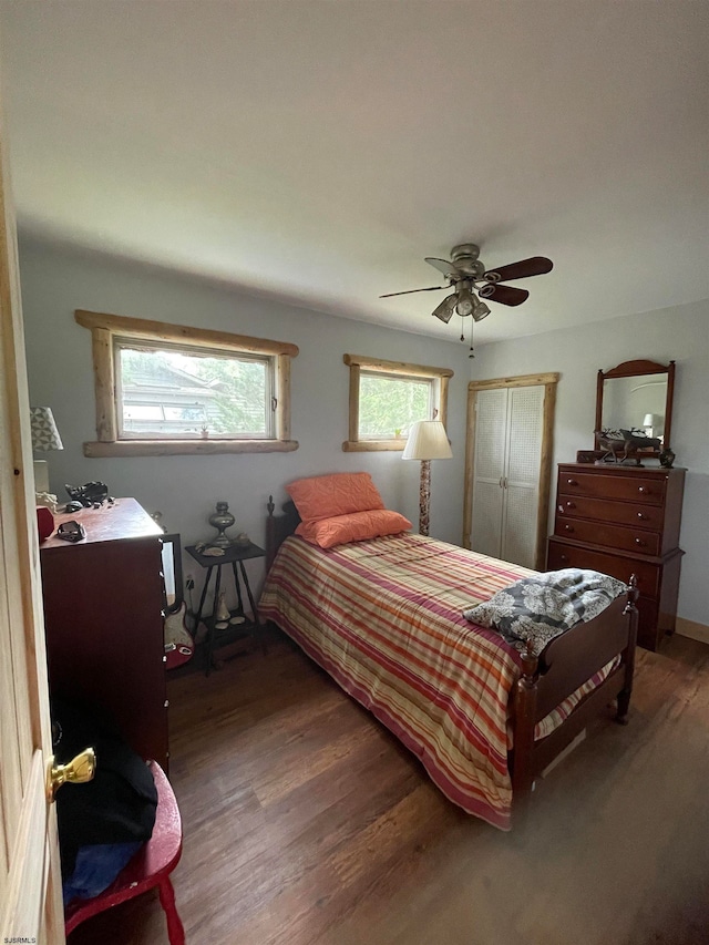 bedroom with hardwood / wood-style flooring and ceiling fan