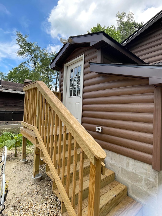 doorway to property featuring a wooden deck