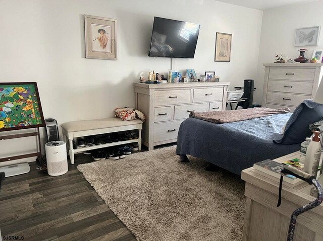 bedroom featuring dark hardwood / wood-style floors