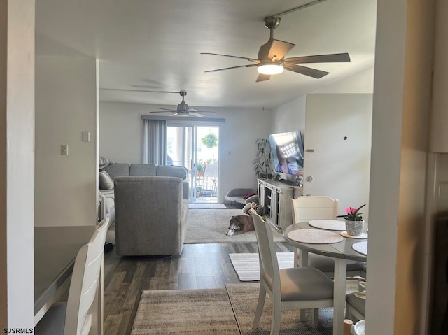 dining room with dark hardwood / wood-style floors and ceiling fan