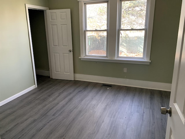 13 Vola Ln, Pleasantville, NJ 08232 - unfurnished bedroom with dark wood-style flooring and multiple windows