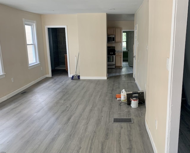 13 Vola Ln, Pleasantville, NJ 08232 - unfurnished living room featuring baseboards, wood finished floors, and visible vents