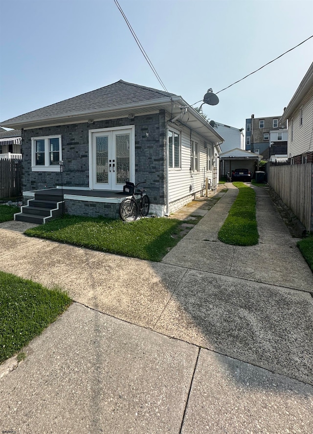 rear view of property with french doors