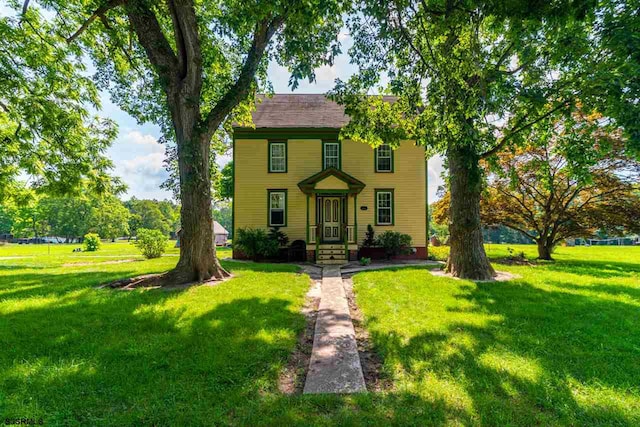 view of front of home with a front yard