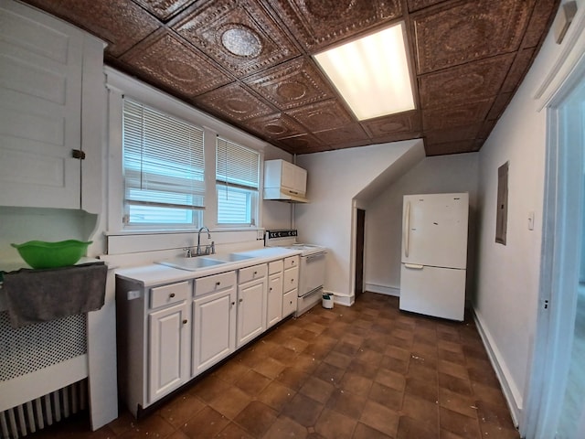 kitchen featuring white cabinets, electric panel, white appliances, and sink