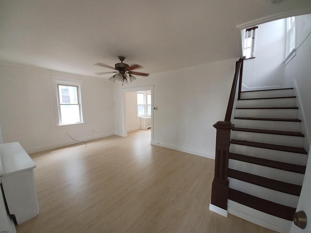 interior space featuring light wood-type flooring and ceiling fan