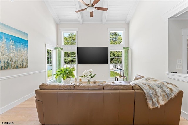 living room featuring wood ceiling, ceiling fan, beam ceiling, ornamental molding, and light wood-type flooring