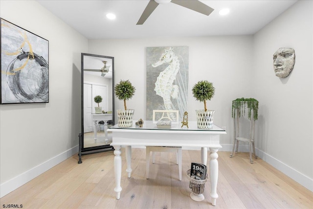 office space featuring light hardwood / wood-style flooring and ceiling fan