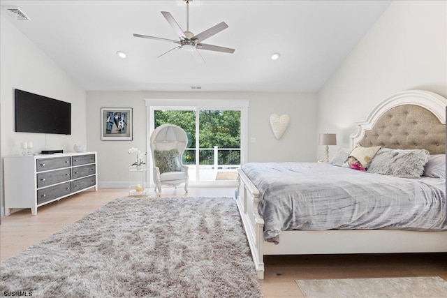 bedroom with ceiling fan, light wood-type flooring, access to outside, and vaulted ceiling