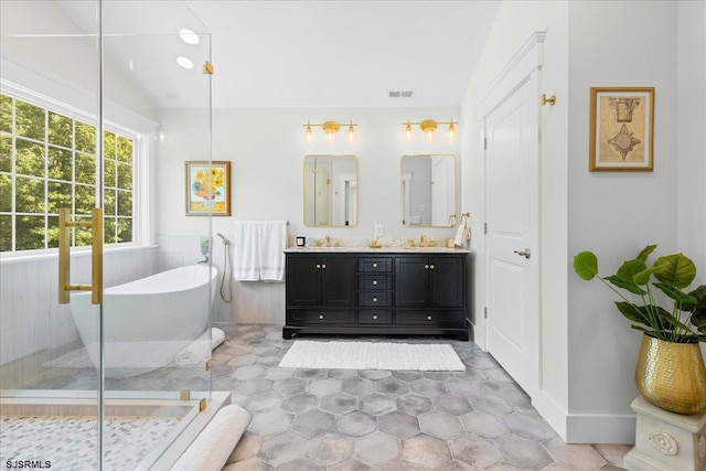 bathroom with vaulted ceiling, shower with separate bathtub, double sink vanity, and tile patterned flooring