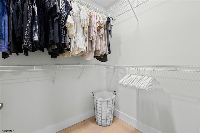 walk in closet featuring hardwood / wood-style floors