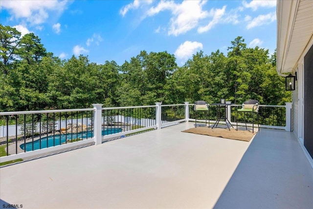 view of patio with a fenced in pool