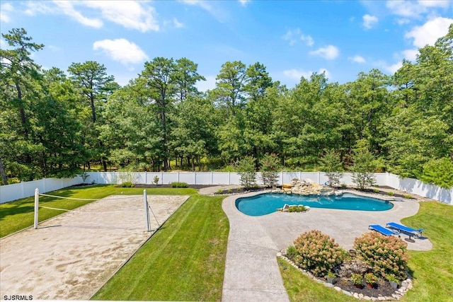 view of swimming pool featuring a patio area and a yard