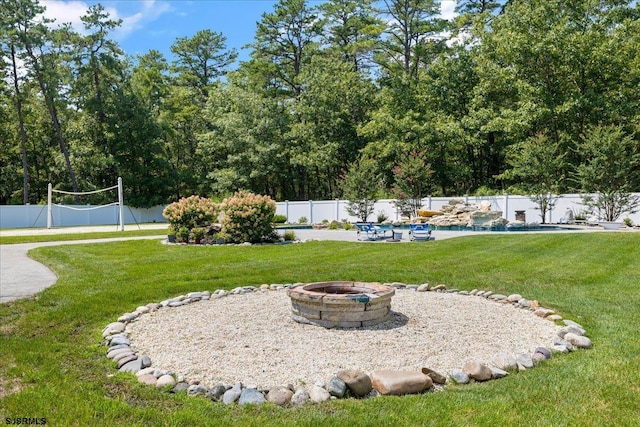 view of yard with an outdoor fire pit