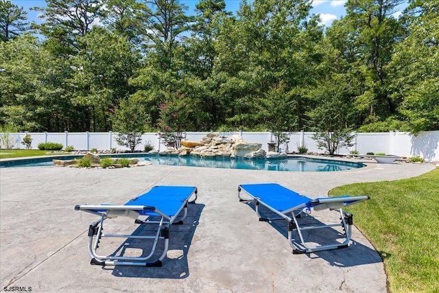 view of swimming pool featuring a patio