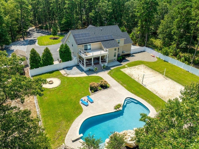 view of pool with a patio area and a yard