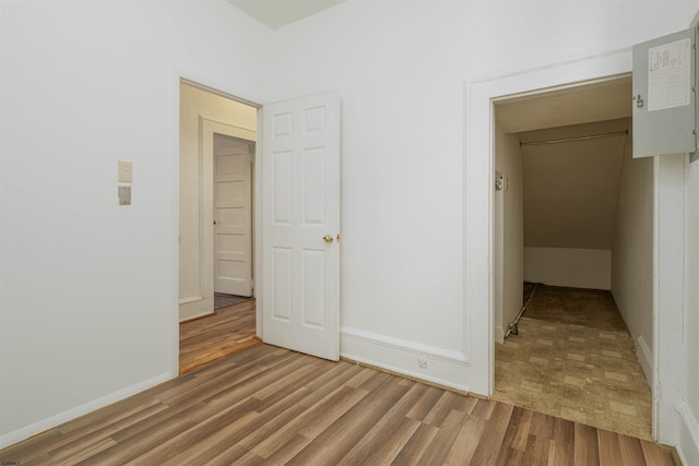 unfurnished bedroom featuring hardwood / wood-style floors