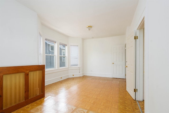 unfurnished room featuring light parquet floors