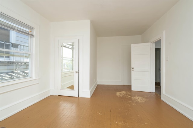 empty room featuring hardwood / wood-style flooring