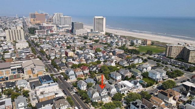 aerial view featuring a water view and a view of the beach