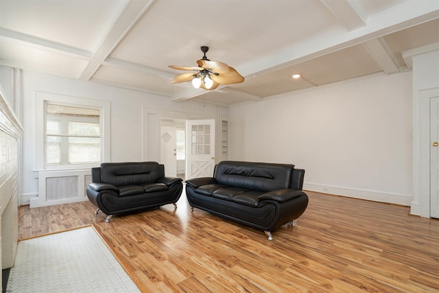 living room with ceiling fan, coffered ceiling, beam ceiling, and light hardwood / wood-style flooring