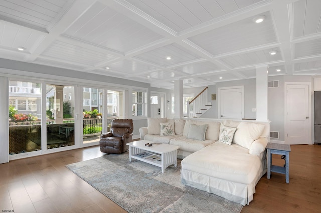 living room featuring coffered ceiling, hardwood / wood-style flooring, and beam ceiling