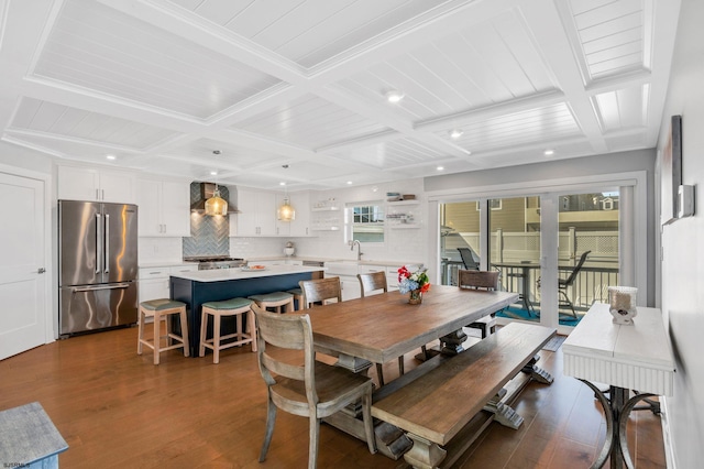 dining room with beamed ceiling, coffered ceiling, and dark wood-type flooring