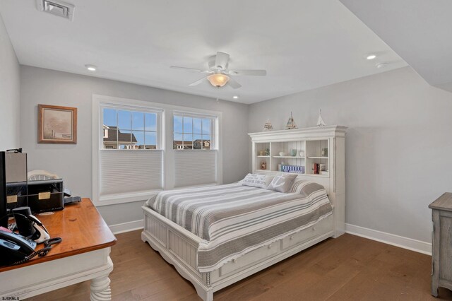 bedroom featuring ceiling fan and hardwood / wood-style flooring