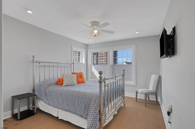 bedroom with hardwood / wood-style floors and ceiling fan