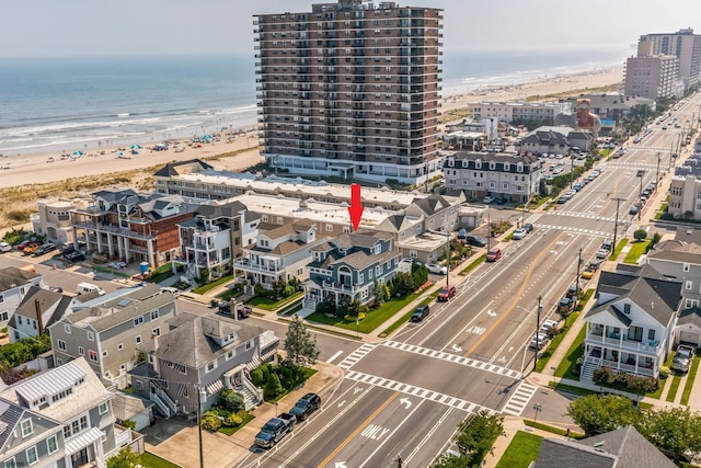 aerial view with a beach view and a water view