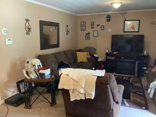 carpeted living room featuring ornamental molding