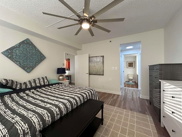 bedroom featuring ceiling fan, a textured ceiling, and hardwood / wood-style flooring