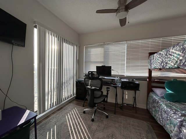 office area with lofted ceiling, a textured ceiling, and wood finished floors