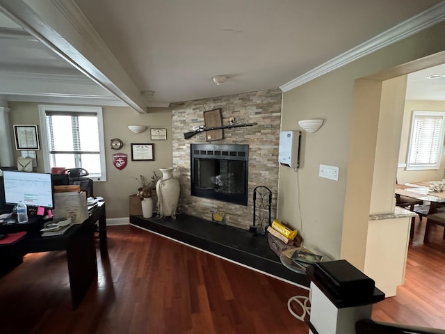 office space with crown molding, a fireplace, dark hardwood / wood-style flooring, and beamed ceiling