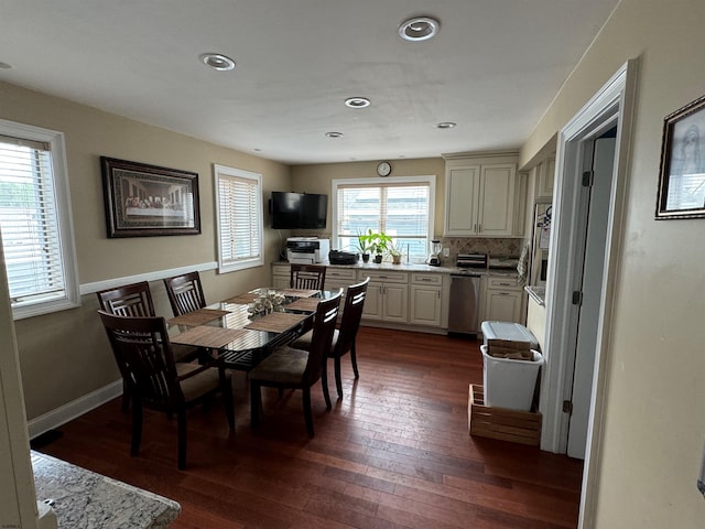 dining area featuring dark hardwood / wood-style flooring