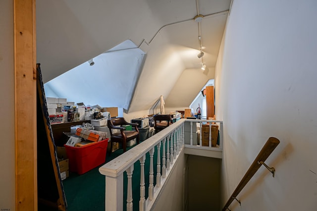 staircase with vaulted ceiling