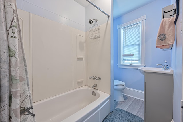 full bathroom featuring shower / bath combo with shower curtain, hardwood / wood-style flooring, and a wealth of natural light