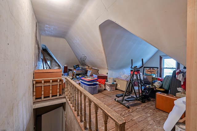 bonus room with vaulted ceiling and light hardwood / wood-style floors