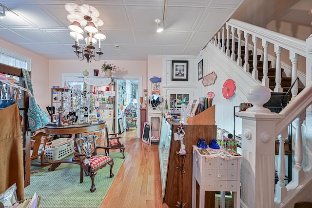 interior space with a notable chandelier and wood-type flooring