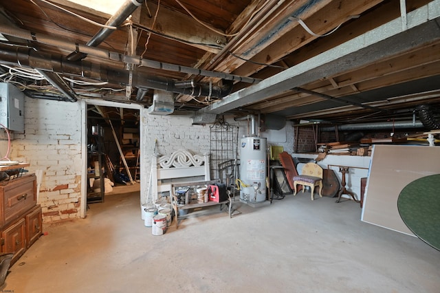 basement with gas water heater and electric panel